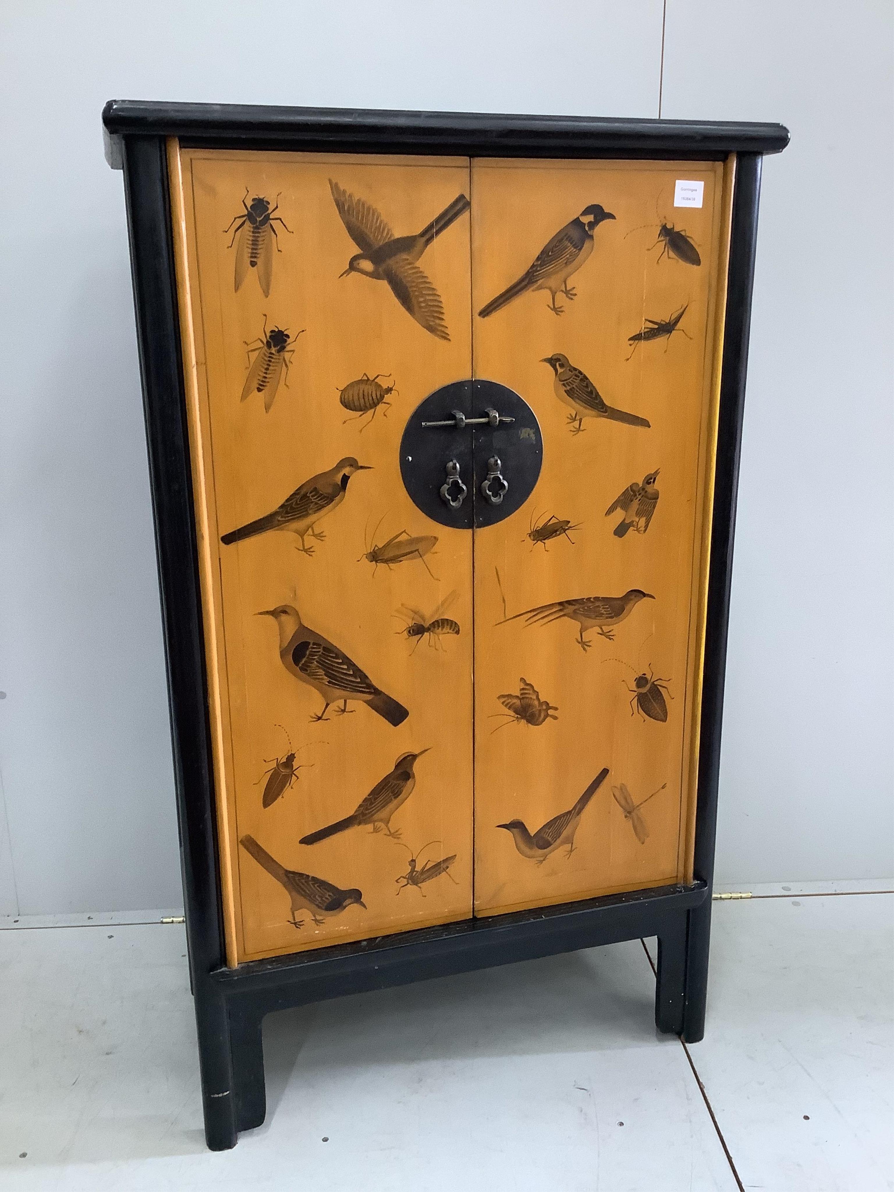 A small modern Chinese two door wardrobe, decorated with birds and insects, width 85cm, depth 45cm, height 140cm. Condition - fair